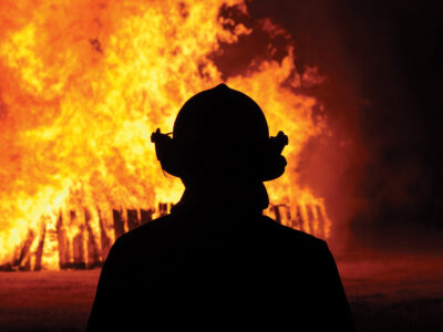 An image of a firefighter and flame.